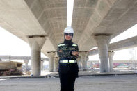 <p>Mai Ibrahim Al-Mesad, project manager of the maritime section of the Jaber Al-Ahmad Causeway, at the construction site in Kuwait City on March 4, 2018. The Jaber Al-Ahmad Causeway is considered one of the longest in the world, covering a distance of 37 kilometers between Kuwait City and Subbiy. (Photo: Yasser al-Zayyat/AFP/Getty Images) </p>