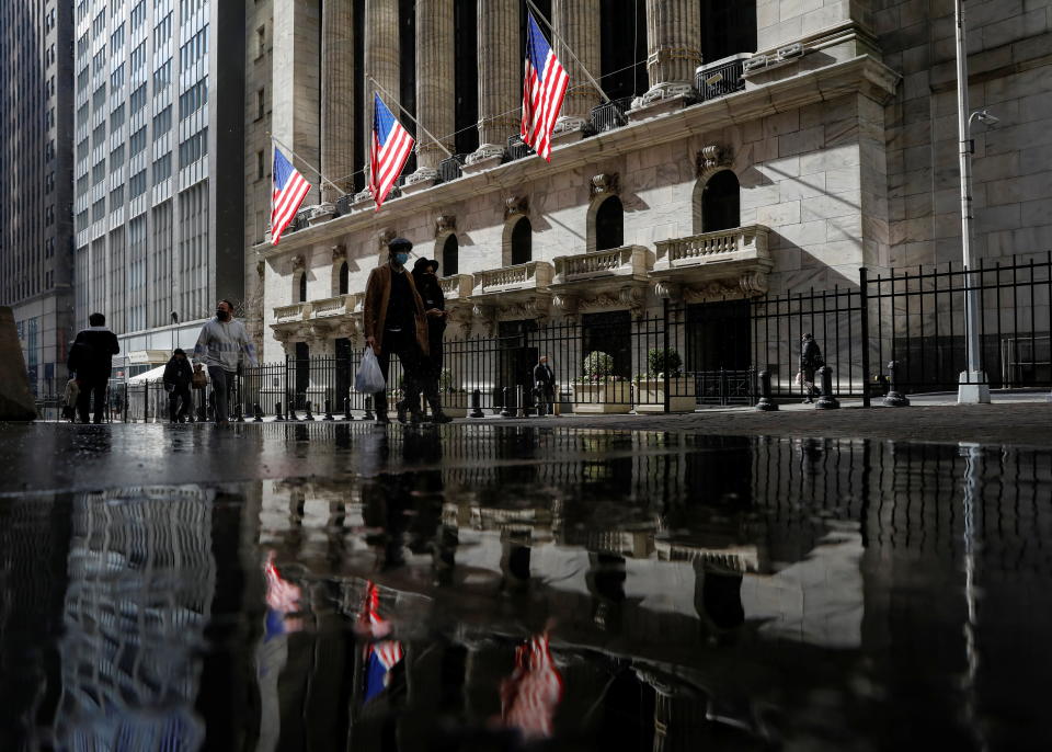 U.S. flags fly out in front of the New York Stock Exchange (NYSE) is seen in New York, U.S., February 16, 2021. REUTERS/Brendan McDermid