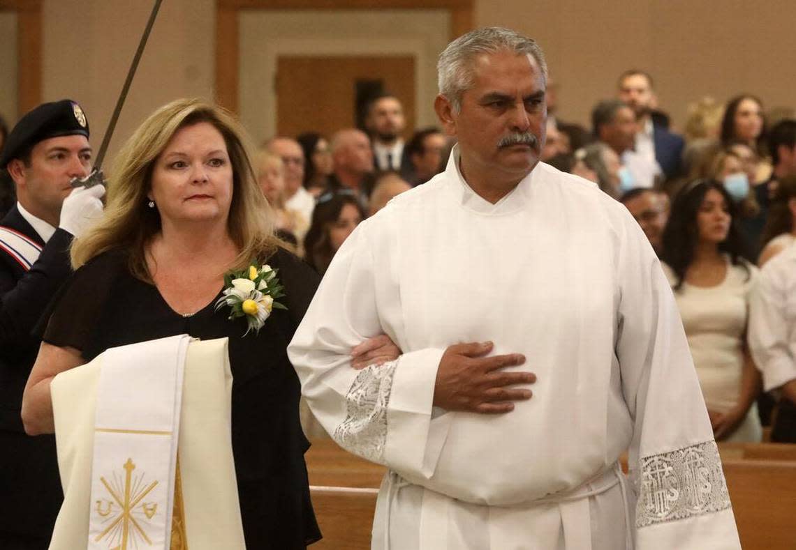 Paul Patrick Márquez and his wife enter Holy Spirit Catholic Church in Fresno on Oct. 1, 2022 during the Mass of Ordination to the Order of Deacon.