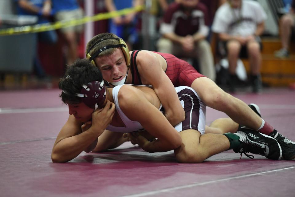 Lake Gibson's Colt Brown competes in a match vs. Brandon's Gabriel Jones. Brown won a regional championship thanks to a 9-3 decision.