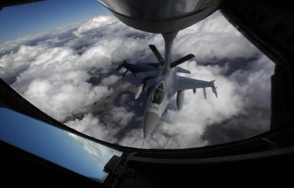 FILE - A U.S. Air Force F-16 refuels in mid-flight from a KC-135 Stratotanker during a Red Flag exercise over The Nevada Test and Training Range on Feb. 10, 2014. Defense Secretary Lloyd Austin hopes that training for Ukrainian pilots on F-16s will begin in the coming weeks, a move that would strengthen Ukraine in the long term, but not necessarily be ready to be part of the nearer term counteroffensive. (John Locher/Las Vegas Review-Journal via AP)