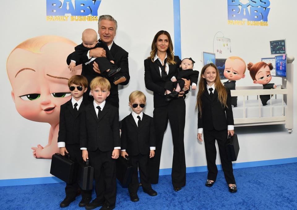 Alec and Hilaria Baldwin matching in suits with their children at "boss baby" premiere