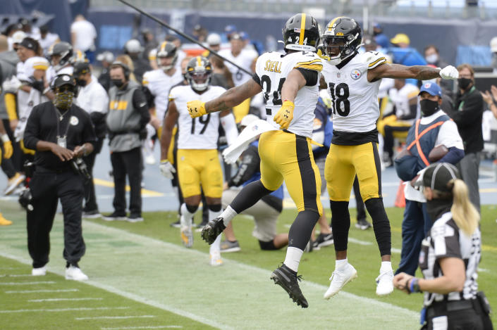Pittsburgh Steelers running back Benny Snell (24) celebrates with wide receiver Diontae Johnson (18) after Snell scored a touchdown against the Tennessee Titans in the first half of an NFL football game Sunday, Oct. 25, 2020, in Nashville, Tenn. (AP Photo/Mark Zaleski)
