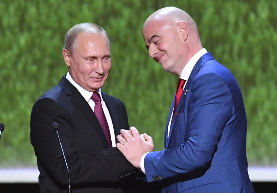 FILE - FIFA President Gianni Infantino, right, and Russian President Vladimir Putin greet each other as they attend a concert at the Bolshoi Theater in Moscow, Russia, on Saturday, July 14, 2018, at the close of the World Cup tournament. (Yuri Kadobnov/Pool Photo via AP, File)