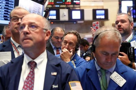 Traders work on the floor of the New York Stock Exchange (NYSE) in New York City, U.S., September 15, 2016. REUTERS/Brendan McDermid