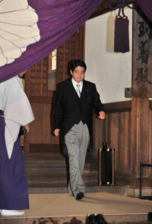 Shinzo Abe, leader of the Liberal Democratic Party, walks out of the Yasukuni Shrine in Tokyo on October 17, 2012. The Yasukuni shrine honors 2.5 million Japanese war dead including war criminals