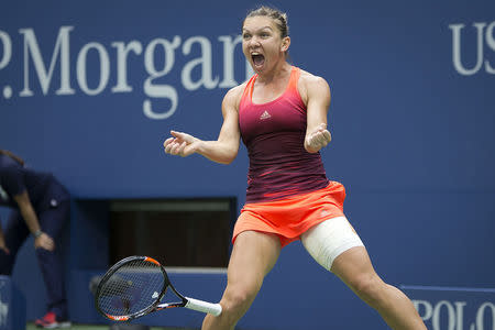 Simona Halep of Romania celebrates after defeating Victoria Azarenka of Belarus in their quarterfinals match at the U.S. Open Championships tennis tournament in New York, September 9, 2015. REUTERS/Carlo Allegri