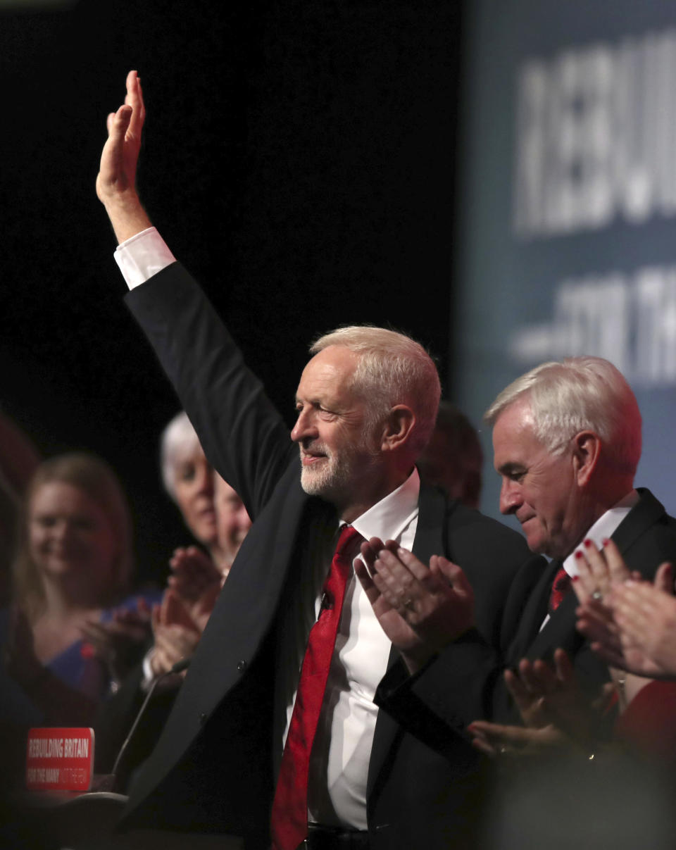 Britain's main opposition Labour Party leader Jeremy Corbyn waves to supporters before giving his keynote speech at the Labour Party's annual conference in Liverpool, England, Wednesday Sept. 26, 2018. (Peter Byrne/PA via AP)