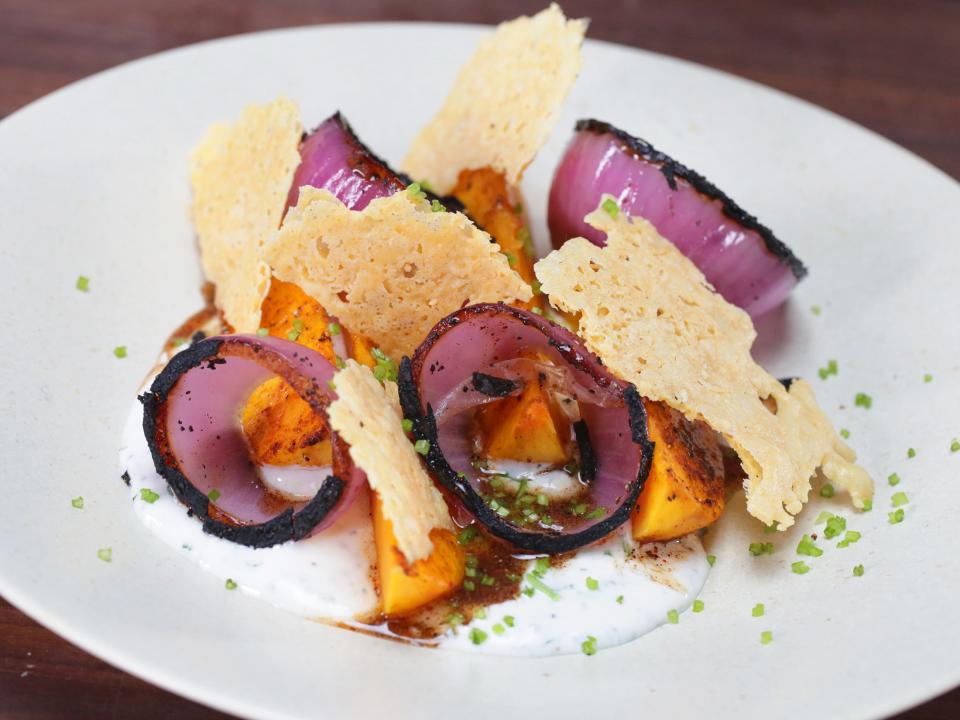 Roasted Winter Squash with Chipotle Honey, Tillamook Cheddar Crisp, Lime Yogurt, and Charred Onion