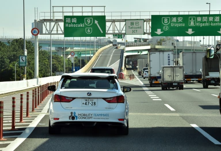 Toyota demonstrates its self-driving Lexus GS450h on the Tokyo metropolitan highway during a presentation in Tokyo, on October 6, 2015