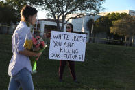 <p>Karissa Saenz, a senior at Marjory Stoneman Douglas High School, holds a sign that reads, ‘ White House You are Killing Our Future!,’ on February 18, 2018 in Parkland, Fla. (Photo: Joe Raedle/Getty Images) </p>