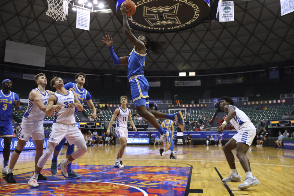 UCLA guard Sebastian Mack (12) makes a layup against Chaminade during the second half of an NCAA college basketball game Tuesday, Nov. 21, 2023, in Honolulu. (AP Photo/Marco Garcia)