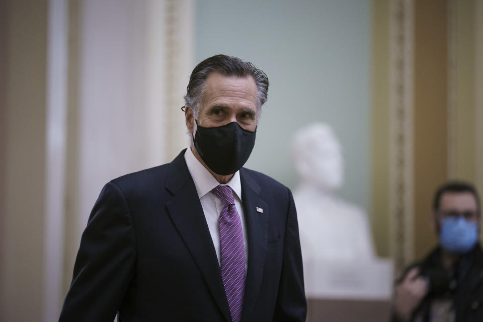 Sen. Mitt Romney, R-Utah, returns to the chamber from a short break as House impeachment managers present their second day of arguments in the Senate trial of former President Donald Trump, at the Capitol in Washington, Thursday, Feb. 11, 2021. (AP Photo/J. Scott Applewhite)