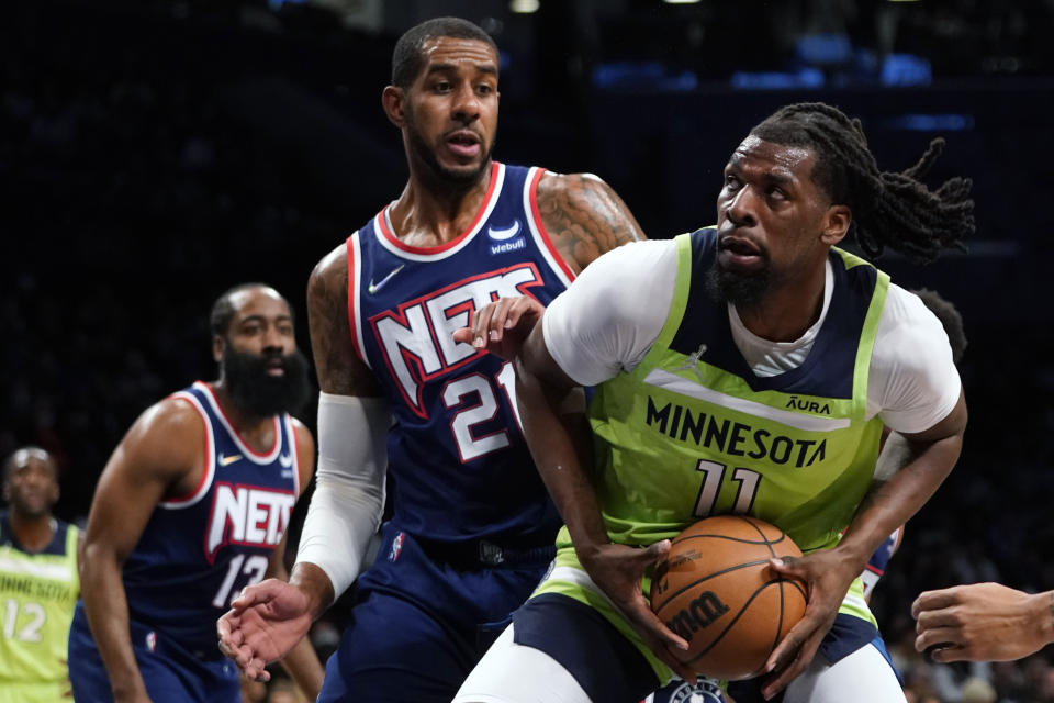 Brooklyn Nets center LaMarcus Aldridge (21) guards Minnesota Timberwolves center Naz Reid (11) during the first half of an NBA basketball game Friday, Dec. 3, 2021, in New York. (AP Photo/Mary Altaffer)