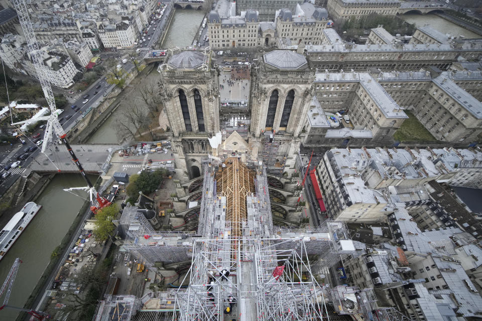 Notre Dame de Paris cathedral is pictured from the top of the spire Friday, Dec. 8, 2023 in Paris. French President Emmanuel Macron is visiting Notre Dame Cathedral on Friday, marking the one-year countdown to its reopening in 2024 following extensive restoration after the fire four years ago. Macron's visit, continuing his annual tradition since the blaze on April 15 2019, is aimed to highlight the progress in the works, including the near completion of the cathedral spire. (AP Photo/Christophe Ena, Pool)