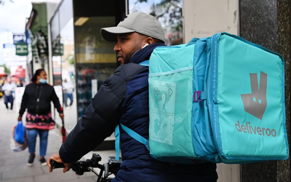 A Deliveroo food courier at work in London - Andy Rain/EPA-EFE/Shutterstock