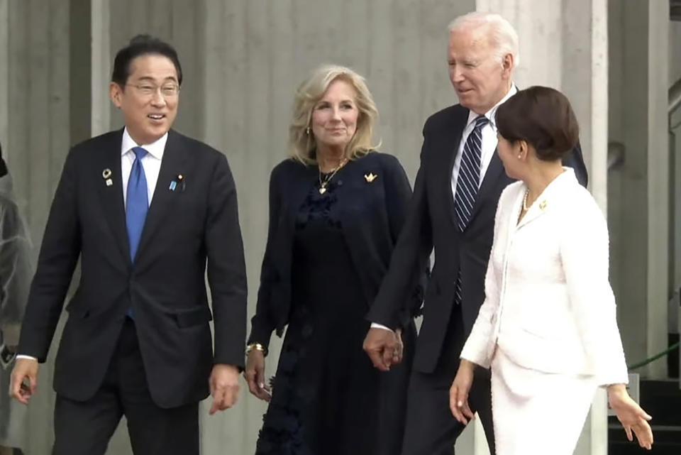 In this image from a video, U.S. President Joe Biden, second right, first lady Jill Biden, second left, Japan's Prime Minister Fumio Kishida and his wife Yuko Kishida head to Hiroshima Peace Memorial Museum at the Peace Memorial Park during a visit as part of the G7 Hiroshima Summit in Hiroshima, western Japan Friday, May 19, 2023. (Kyodo News via AP)