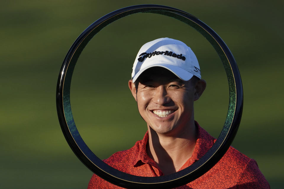 Collin Morikawa of the United States poses with the trophy after winning the PGA Tour Zozo Championship at the Narashino Country Club in Inzai on the outskirts of Tokyo, Sunday, Oct. 22, 2023. (AP Photo/Tomohiro Ohsumi)