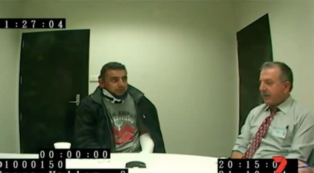 Sarmad Nisan speaking with police following the crash. Source: 7 News