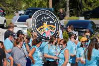 Crowd gathers to see Inspiration 4 civilian crew before they leave for lauch at SpaceX facility at the Kennedy Space Center