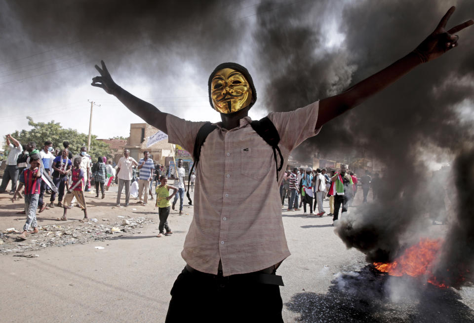 FILE - A man flashes the victory sign during a protest to denounce the October 2021 military coup, in Khartoum, Sudan, Jan. 9, 2022. Since the coup, security forces launched a deadly crackdown on protesters. Many activists were taken from their homes or snatched from the streets, according to documents he provided to The Associated Press. Around 80 people, mostly young men, were killed and over 2,200 others were wounded in the protests since the coup, according to a Sundanese medical group. (AP Photo/Marwan Ali, File)