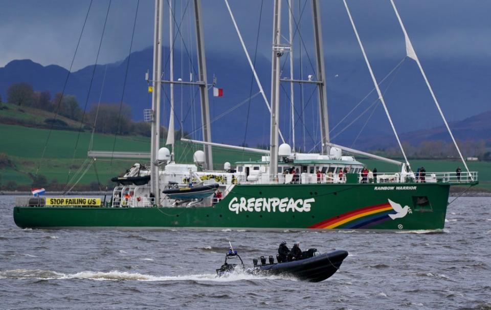 The Greenpeace ship Rainbow Warrior makes its way up the River Clyde, near Greenock carrying four young climate activists from areas affected by climate change (Andrew Milligan/PA) (PA Wire)