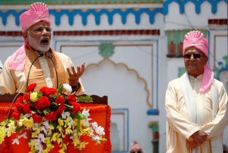 India's Prime Minister Narendra Modi speaks with the media as Nepal's Prime Minister Khadga Prasad Sharma Oli, also known as K.P. Oli, stands next to him during his visit at Janaki Mandir, a Hindu temple dedicated to goddess Sita, in Janakpur, Nepal May 11, 2018. REUTERS/Navesh Chitrakar