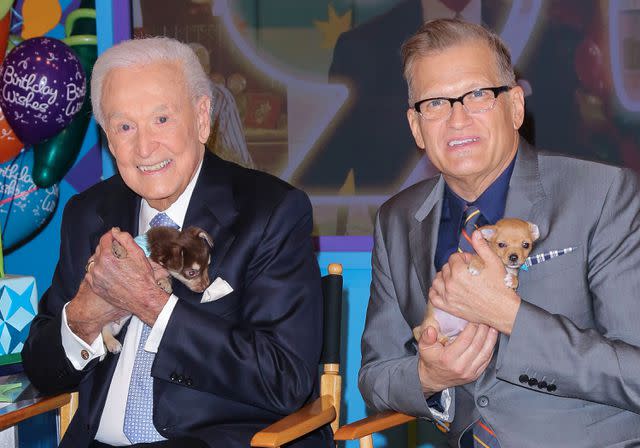 <p>Paul Archuleta/FilmMagic</p> Bob Barker (L) and Drew Carey pose with puppies on the set of "The Price Is Right" to celebrate Barker's 90th Birthday.