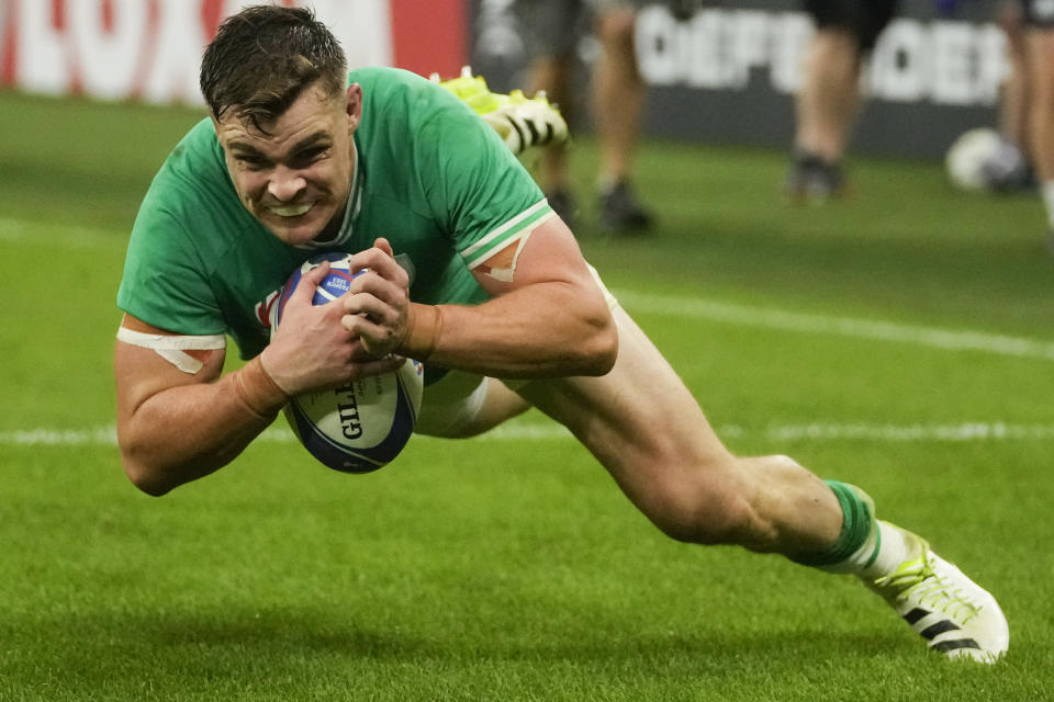 Ireland's Garry Ringrose scores a try during the Rugby World Cup Pool B match between Ireland and Scotland at the Stade de France in Saint-Denis outside of Paris, Saturday, Oct. 7, 2023. (AP Photo/Thibault Camus)