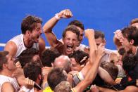 <p>Team Belgium celebrates their victory in the Men's Gold Medal match between Australia at Oi Hockey Stadium on August 5.</p>