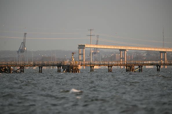 A section of the roadway still stands after the collapse of the Francis Scott Key Bridge after it was struck by a container ship, in Baltimore, Maryland, on March 26, 2024. The collapsed sent multiple vehicles and up to 20 people plunging into the harbor below. 