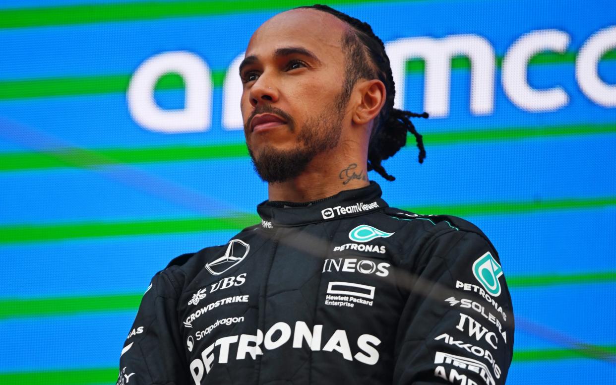 Third placed Lewis Hamilton of Great Britain and Mercedes stands on the podium after the F1 Grand Prix of Spain at Circuit de Barcelona-Catalunya on June 23, 2024 in Barcelona, Spain.