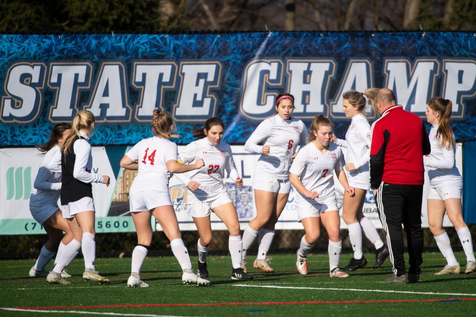 The General McLane Lancers warm up in front of head coach Josh Hopkins before playing in the PIAA Class 2A girls' soccer championship game against Central Columbia at Eagle View Middle School on Saturday, Nov. 19, 2022, in Mechanicsburg.