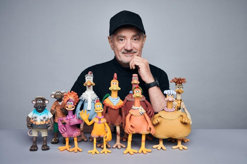 Director Sam Fell of Chicken Run: Dawn of the Nugget with several of the puppets from his film.