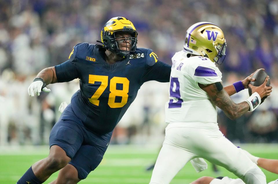 Kenneth Grant sacks Washington's Michael Penix Jr. in the second quarter of the national championship game.