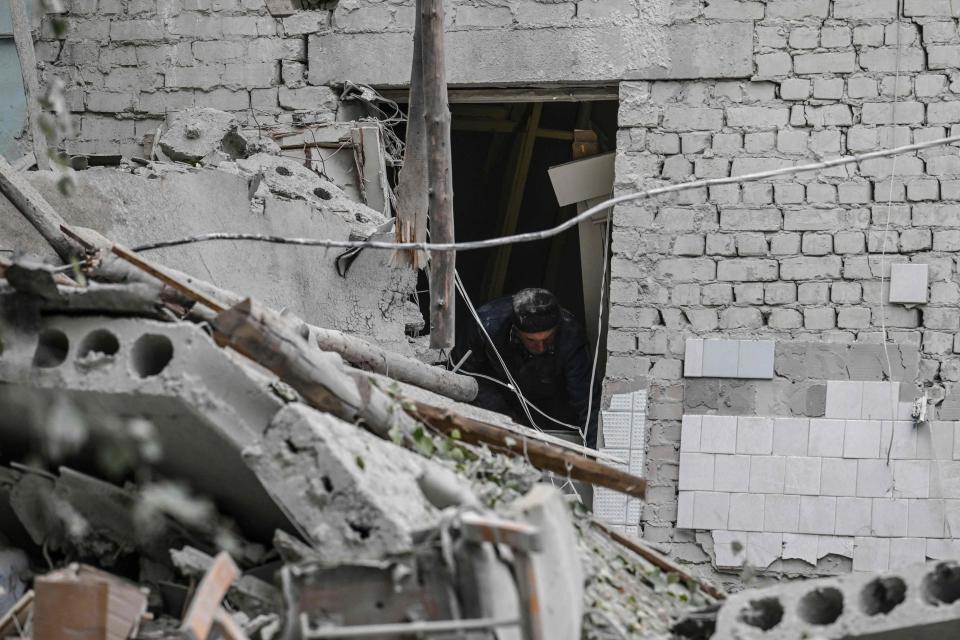 A man stands inside of a destroyed maternity hospital in Kramatorsk, Donetsk region, on September 12, 2022, amid the Russian invasion of Ukraine. (Photo by Juan BARRETO / AFP) (Photo by JUAN BARRETO/AFP via Getty Images)