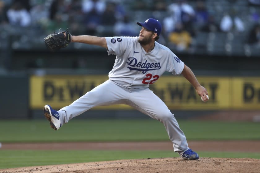 Los Angeles Dodgers pitcher Clayton Kershaw throws to an Oakland Athletics batter during the first inning of a baseball game in Oakland, Calif., Tuesday, April 6, 2021. (AP Photo/Jed Jacobsohn)