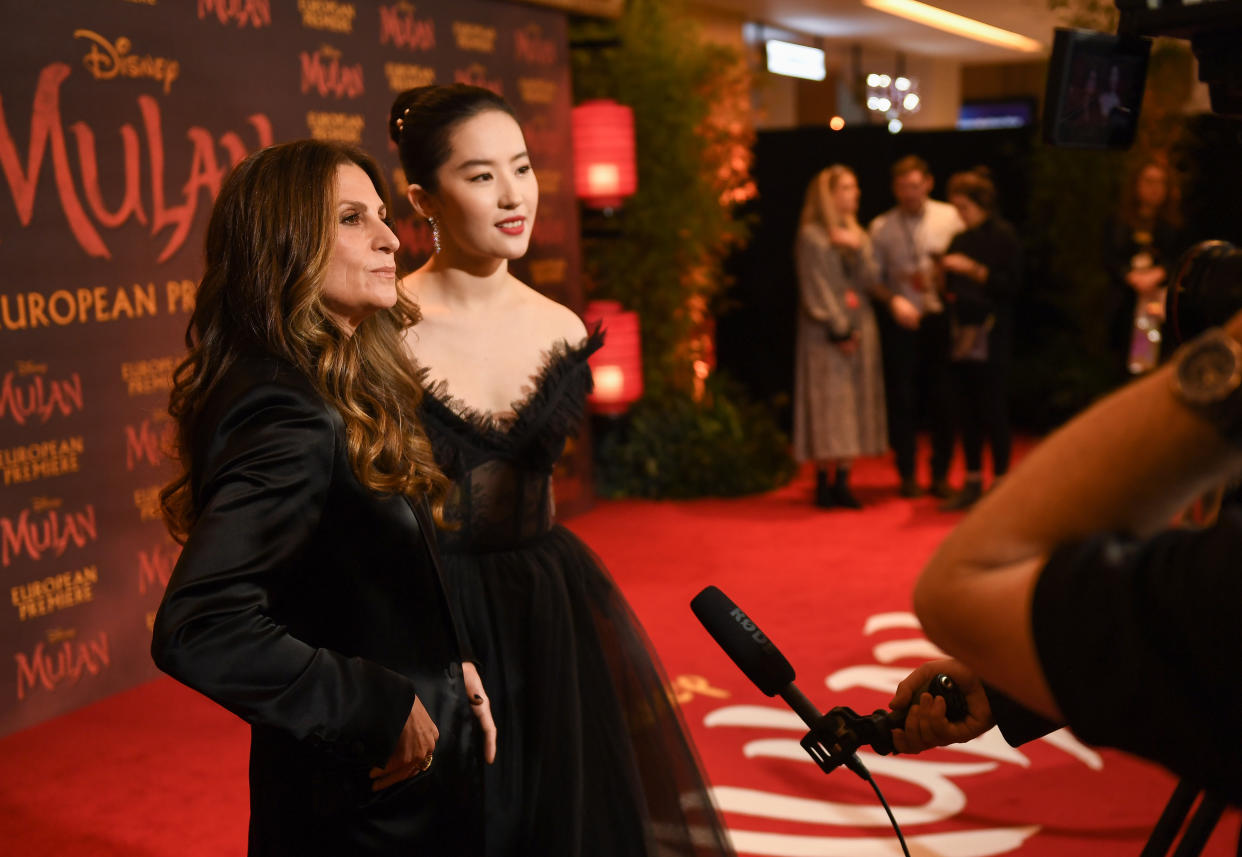 LONDON, ENGLAND - MARCH 12:  Niki Caro (L) and Yifei Liu attend the European Premiere of Disney's "MULAN" at Odeon Luxe Leicester Square on March 12, 2020 in London, England. (Photo by Ian Gavan/Getty Images for Disney)