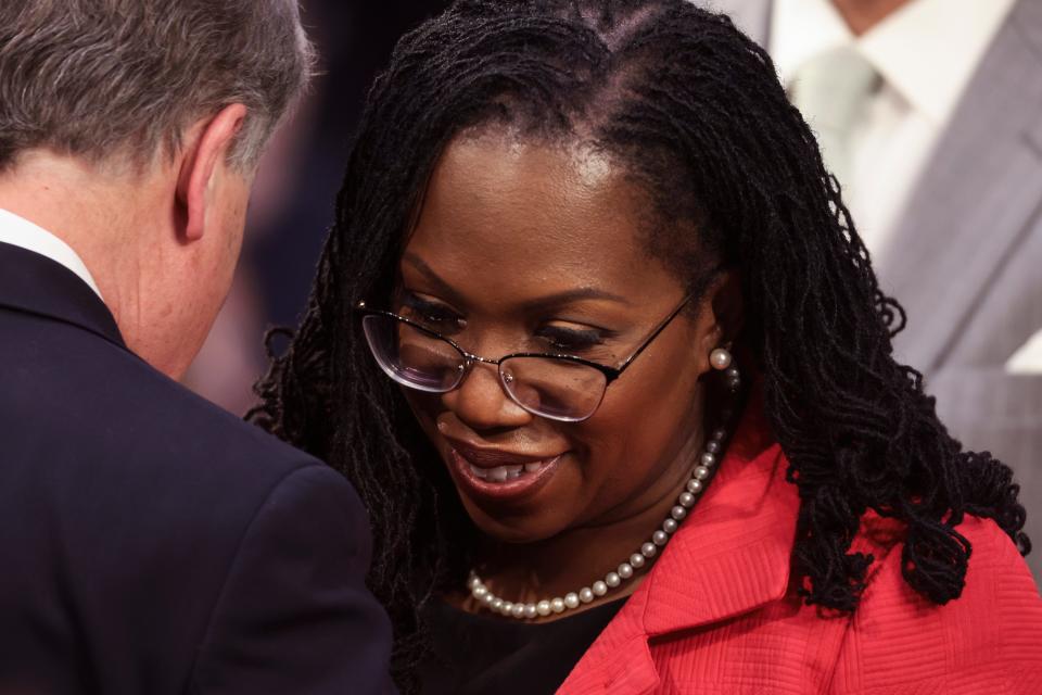 WASHINGTON, DC - MARCH 22: U.S. Supreme Court nominee Judge Ketanji Brown Jackson talks to White House liaison former Senator Doug Jones as she returns to her seat following a break in her confirmation hearing before the Senate Judiciary Committee, in the Hart Senate Office Building on Capitol Hill March 22, 2022 in Washington, DC.