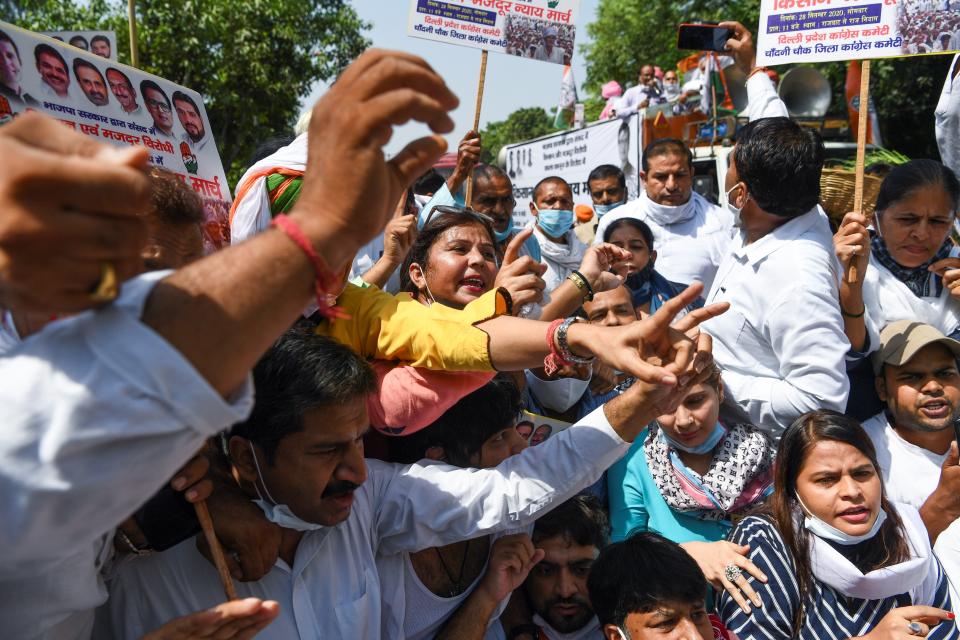 Congress Party activists shout slogans during an anti-government demonstration to protest against the recent passing of new farm bills in parliament in New Delhi on September 28, 2020. (Photo by Sajjad HUSSAIN / AFP) (Photo by SAJJAD HUSSAIN/AFP via Getty Images)