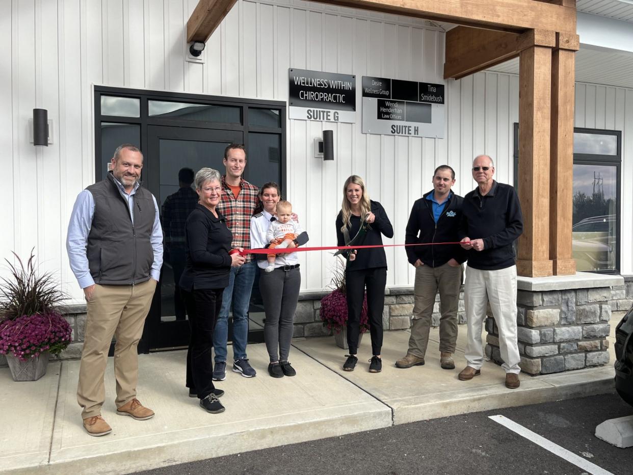 Dr. Emily Miller cuts the ribbon at the grand opening of Wellness Within Chiropractic.