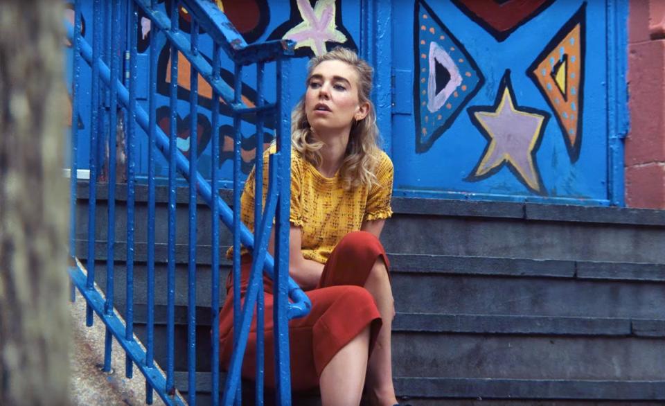 Vanessa Kirby sitting on stairs