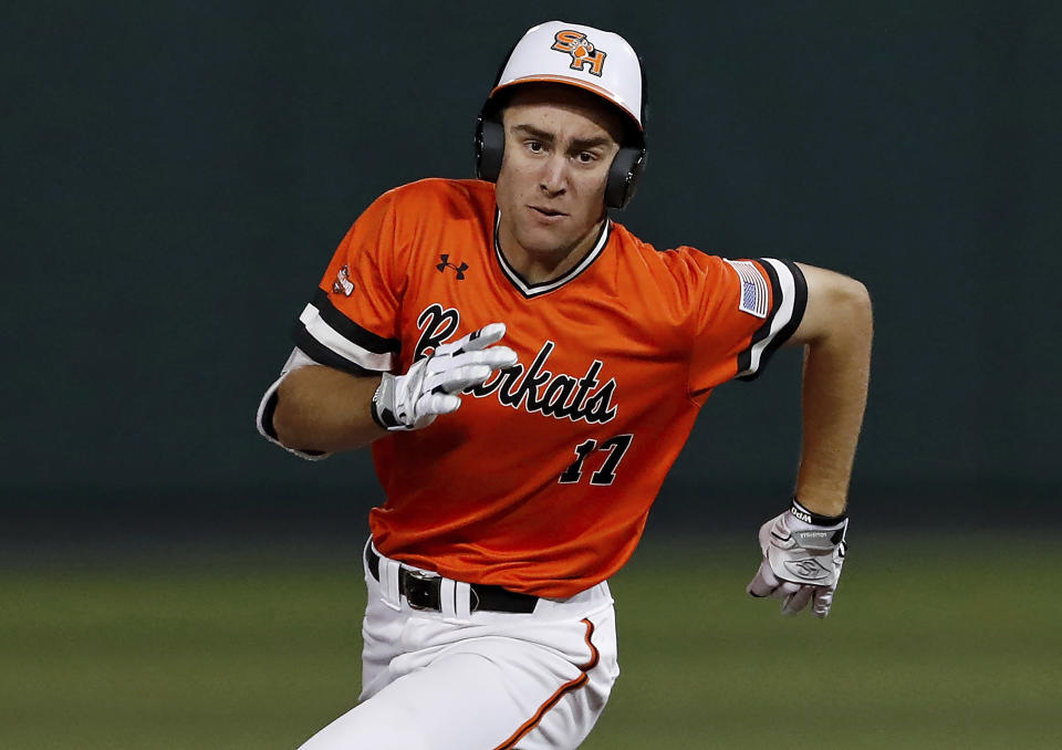 FILE - In this Saturday, April 6, 2019 file photo, Colton Cowser (17) runs the bases during an Lamar University at Sam Houston State University NCAA college baseball game in Huntsville, Texas. Cowser was not recruited by the big baseball schools coming out of high school, but he's molded himself into a potential first-round draft pick. He's extremely polished defensively, and he's better offensively than he showed when he batted .255 over 14 games. He batted .361 with seven homers in 2019.(AP Photo/Aaron M. Sprecher, File)