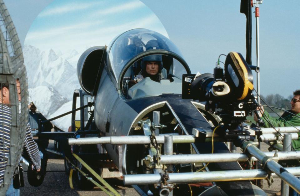 <p>Pierce Brosnan filming a scene in a fake L-39 Albatros for the opening sequence of <em>Tomorrow Never Dies.</em></p>