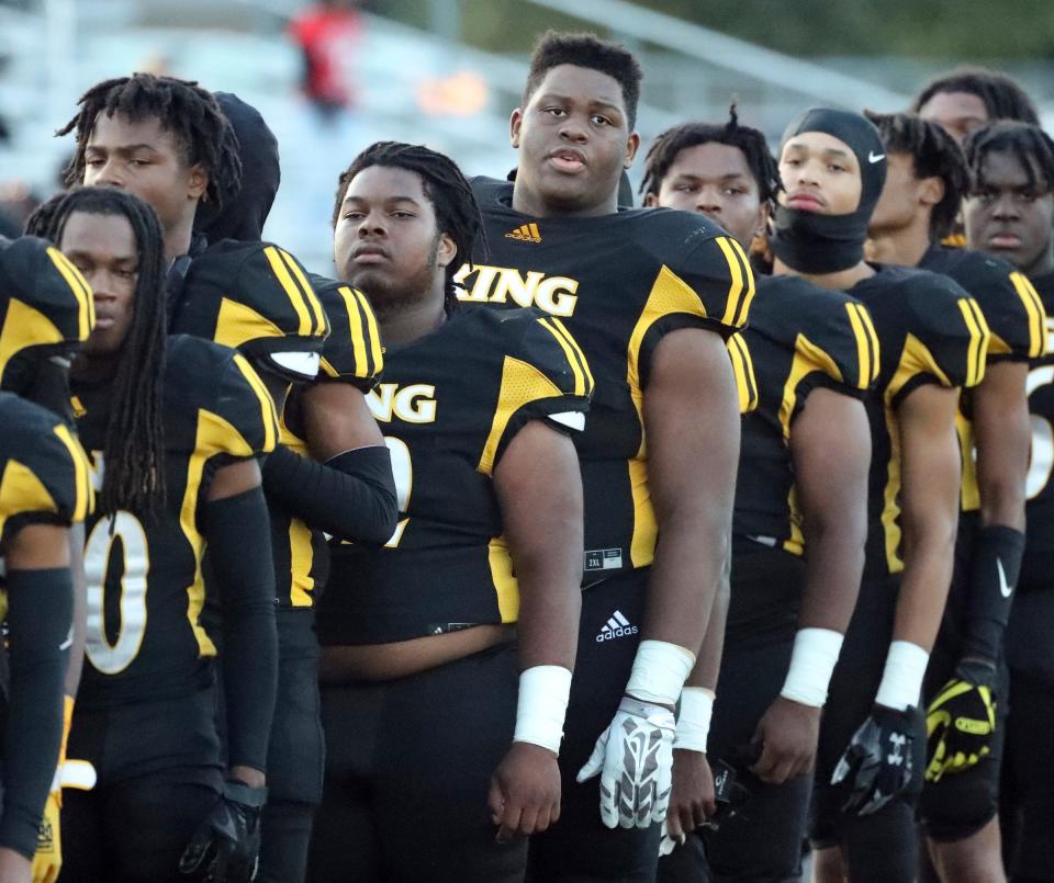 Detroit King players on the sidelines before the game against Cass Tech at Martin Luther King Jr. High School in Detroit on Friday, Sept. 15, 2023.