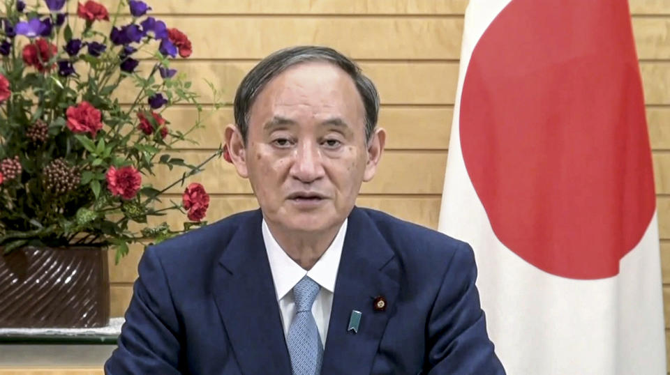 In this image taken from video provided by UN Web TV, Suga Yoshihide, Prime Minister of Japan, remotely addresses the 76th session of the United Nations General Assembly in a pre-recorded message, Friday Sept. 24, 2021, at UN headquarters. (UN Web TV via AP)