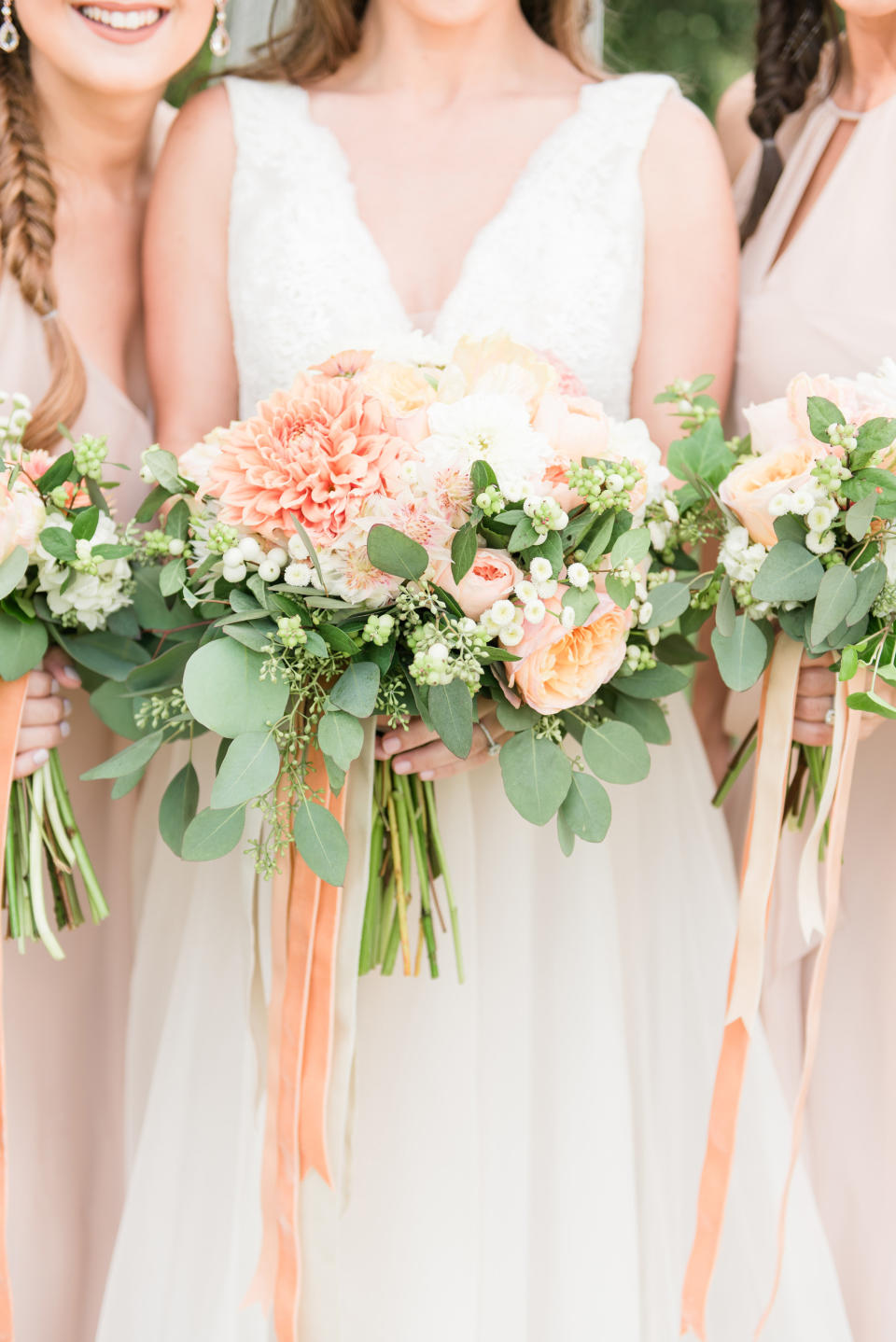 <p>"Classic fall hues, orange and green, can be mixed with a light-colored neutral, and peach is a very pretty alternative to ivory or white."</p>