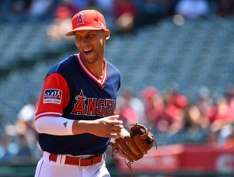 Andrelton Simmons heads off the field after the first inning of a game against the Astros on Aug. 27. (Getty Images)