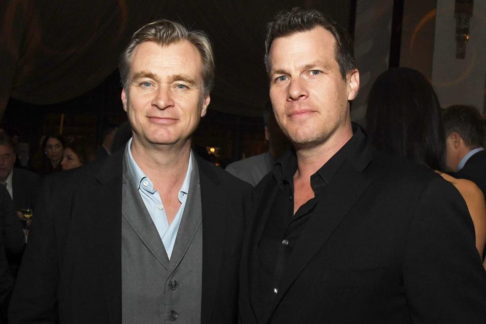 <p>Kevin Winter/Getty</p> Christopher Nolan and Jonathan Nolan pose at the after party for the premiere of HBO