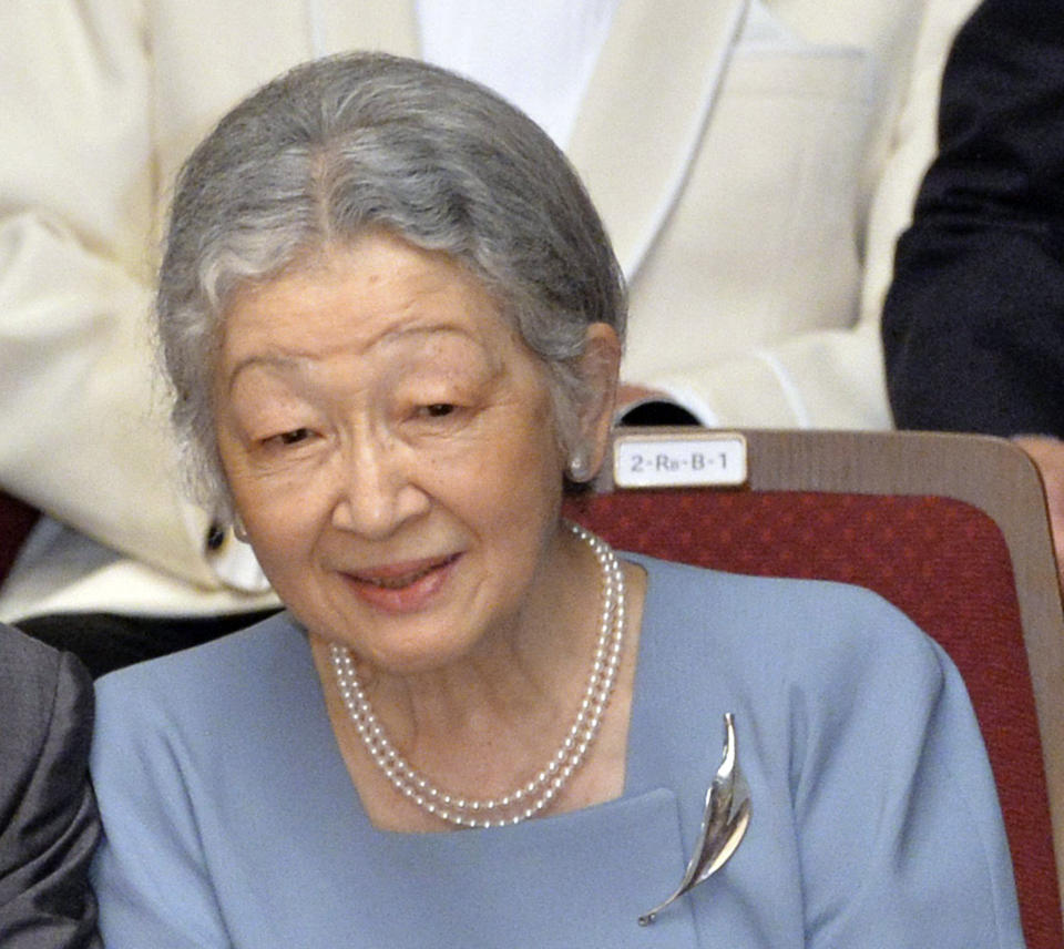 FILE - In this July 7, 2013, file photo, Japanese Empress Michiko watches a concert of the Gakushuin university's alumni in which Crown Prince Naruhito plays the viola at Tokyo Metropolitan Theatre in Tokyo. Japan’s Emperor Akihito, abdicating Tuesday, April 30, 2019, has a relatively small family, and it will shrink in coming years. (Kazuhiro Nogi/Pool Photo via AP, File)